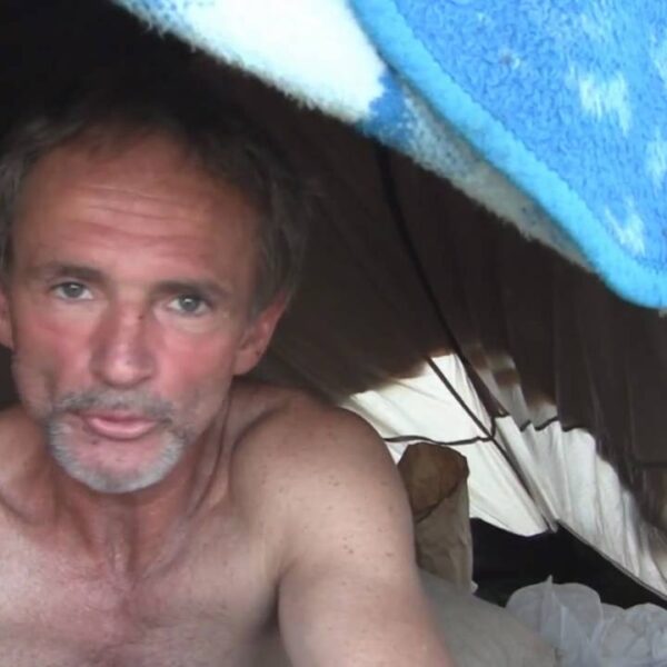 Ray is homeless living in a tent. He walks miles each day for food and water
