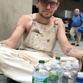 People keep giving this homeless man water even with 9 bottles of water in front of him