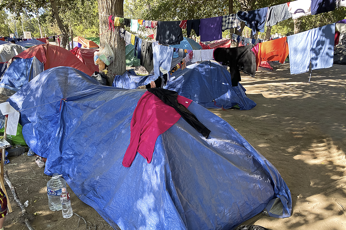 Camping tents, tarpaulins and whatever else can be scavenged to provide shelter constitute “home,” while people wait to cross the border into the US.