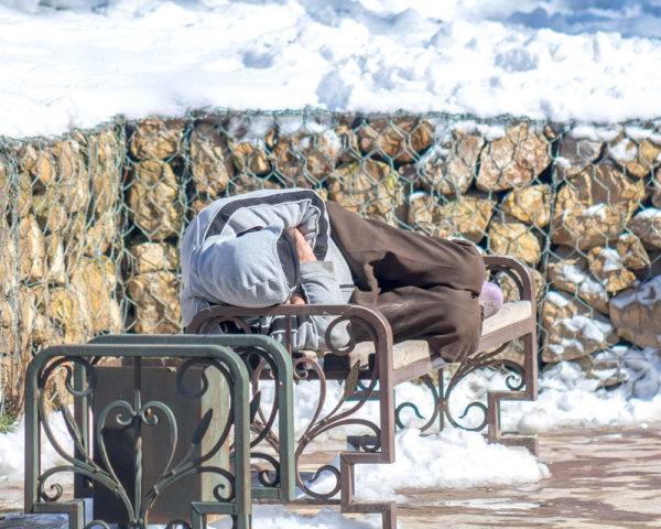 Man Sleeping outdoors in winter