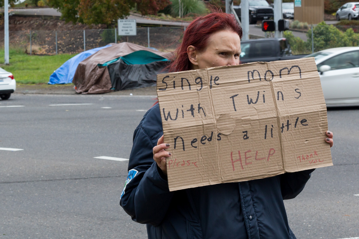 humanitarian crisis - homeless mother asks for help